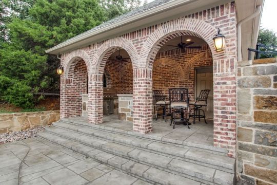 outdoor kitchen with brick wall