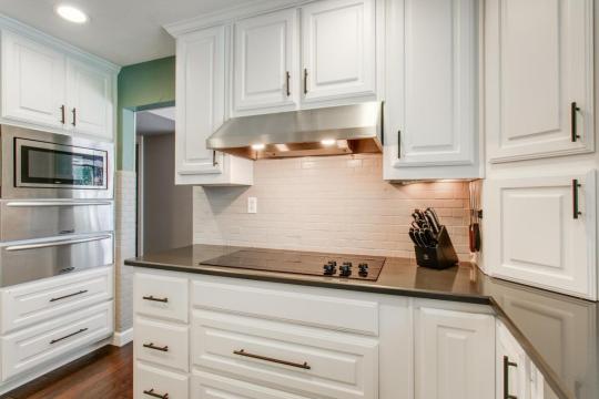 kitchen stove with brick backsplash