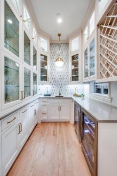 home bar with white cabinetry