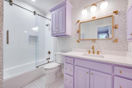 bathroom remodel with purple cabinetry