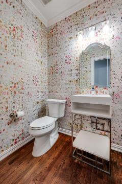 powder room with patterned wallpaper
