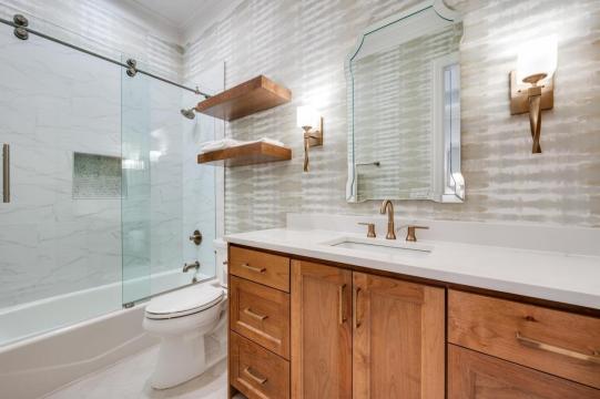 bathroom with wooden vanity and white countertop