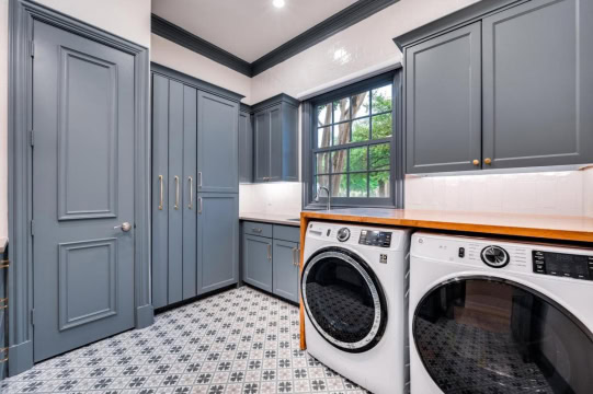 laundry room with patterned tile floor