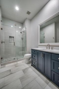 navy bathroom vanity with marble countertop
