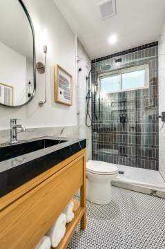 bathroom remodel with hexagon tile flooring
