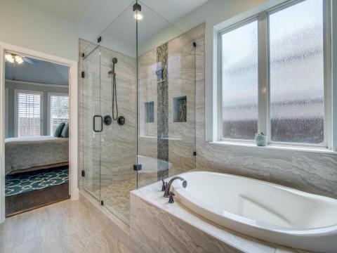 bathroom remodel with shower and bathtub