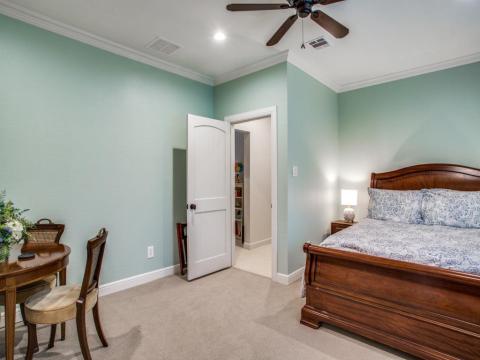 wooden bed and green beroom wall