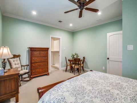wooden cabinets and ceiling fan