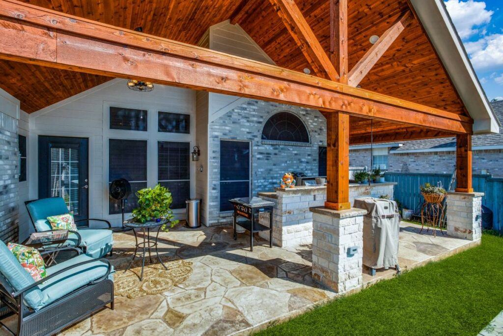 create an outdoor living room with a patio cover or pergola
