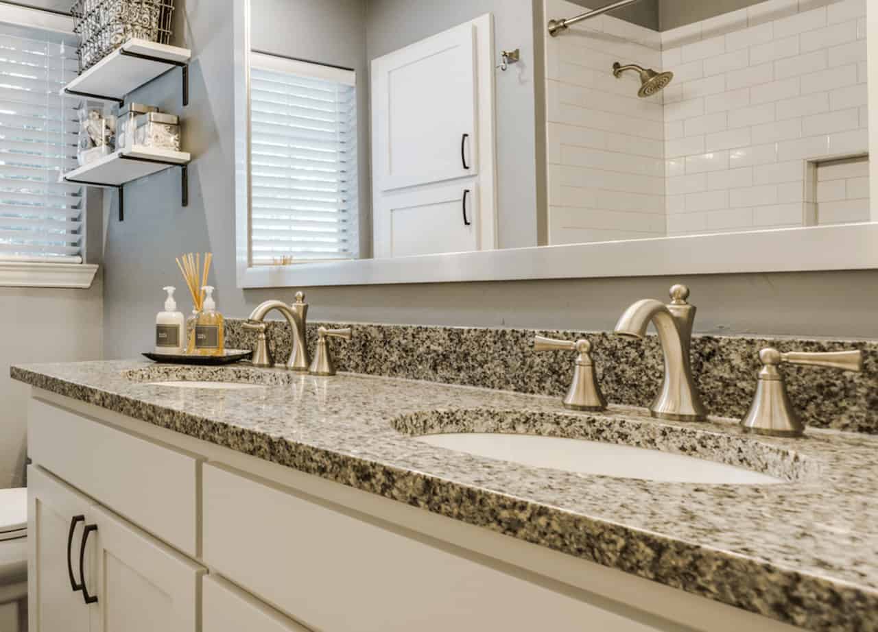 best bathroom designs - project with faucets and a double-vanty sink