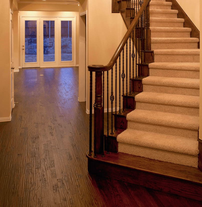 Wood floors and staircase after insurance restoration