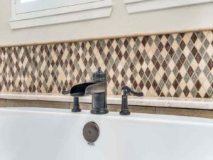 Home Remodeling - Metal faucet fixtures in bath tub