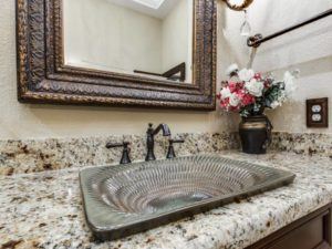 Home Remodeling - uniquely textured metal sink in bathroom