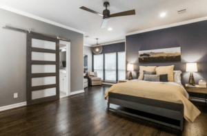 master bedroom - master bedroom with seating area and sliding barn door