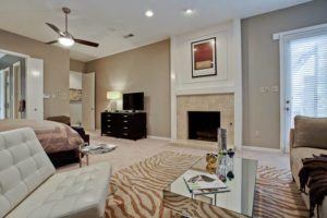 master suite - master bedroom with sitting area and fireplace