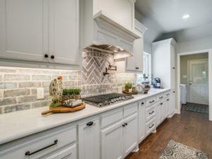 kitchen remodel - farmhouse kitchen with grey brick backsplash