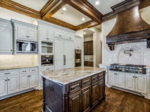 kitchen design trends - remodeled kitchen with light cabinets and decorative stove