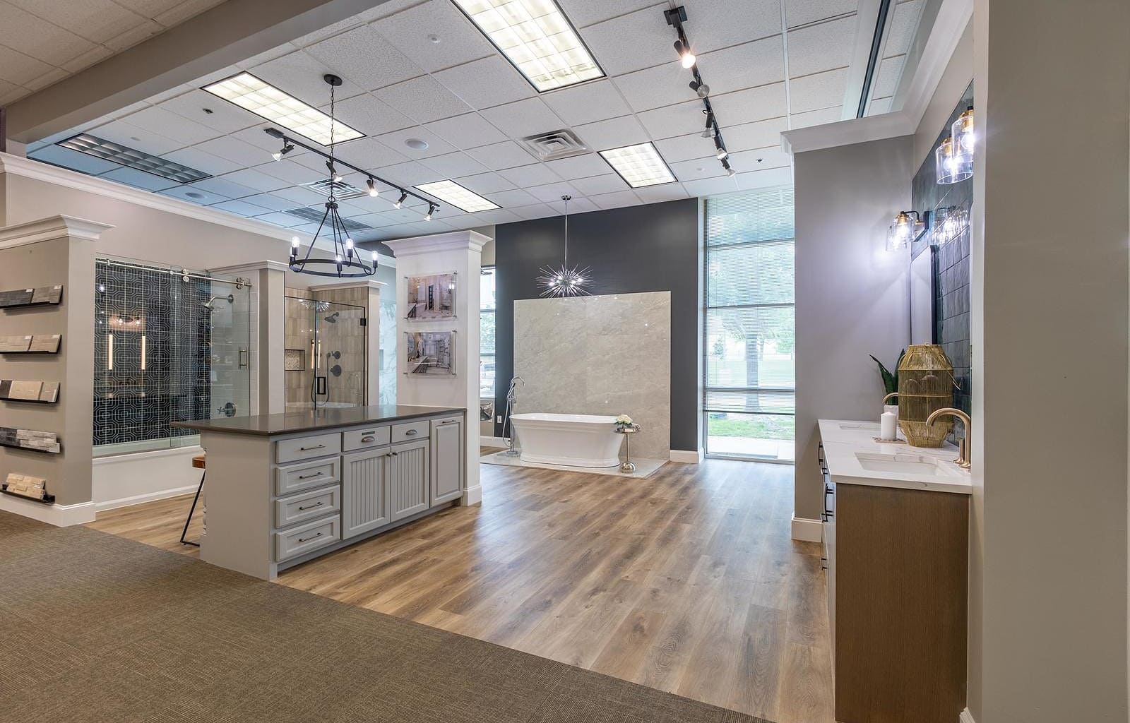 home remodeling showroom with designers picking out tile and faucet hardware
