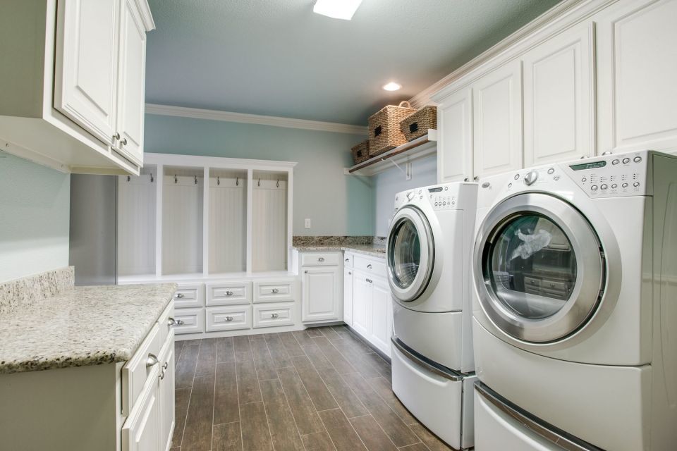 laundry room with cabinets and wood floors - quality home remodeling5