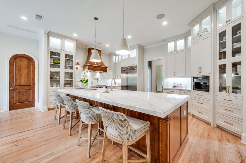 DFWI kitchen remodel with white cabinets and light wood flooring - The Hidden Costs of Kitchen Remodeling and How to Avoid Them