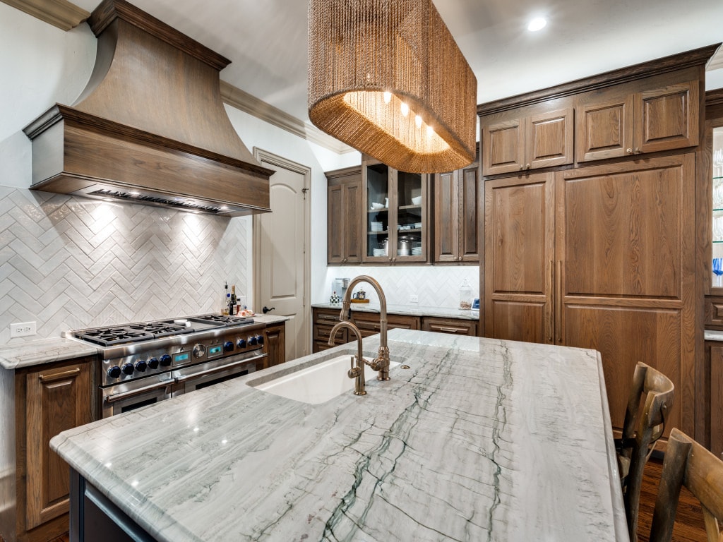 kitchen remodel with dark brown cabinets and quartz countertop